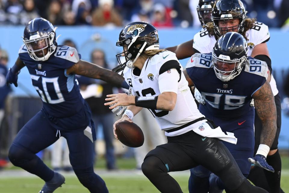 Tennessee Titans defensive end Jeffery Simmons (98) chases Jacksonville Jaguars quarterback Trevor Lawrence (16) on Sunday, Dec. 12, 2021, in Nashville, Tenn.