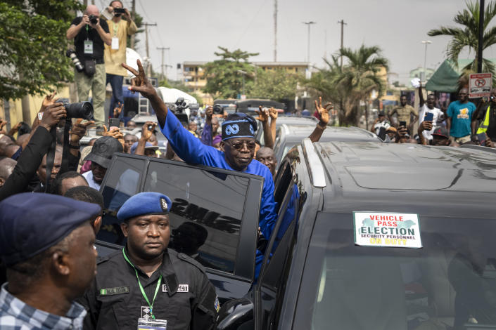 FILE - Presidential candidate Bola Tinubu of the All Progressives Congress gestures to supporters after casting his vote in the presidential elections in Lagos, Nigeria, Feb. 25, 2023. Election officials declared ruling party candidate Bola Tinubu the winner of Nigeria's presidential election early Wednesday, March 1, 2023, with the two leading opposition candidates already demanding a revote in Africa's most populous nation. (AP Photo/Ben Curtis, File)