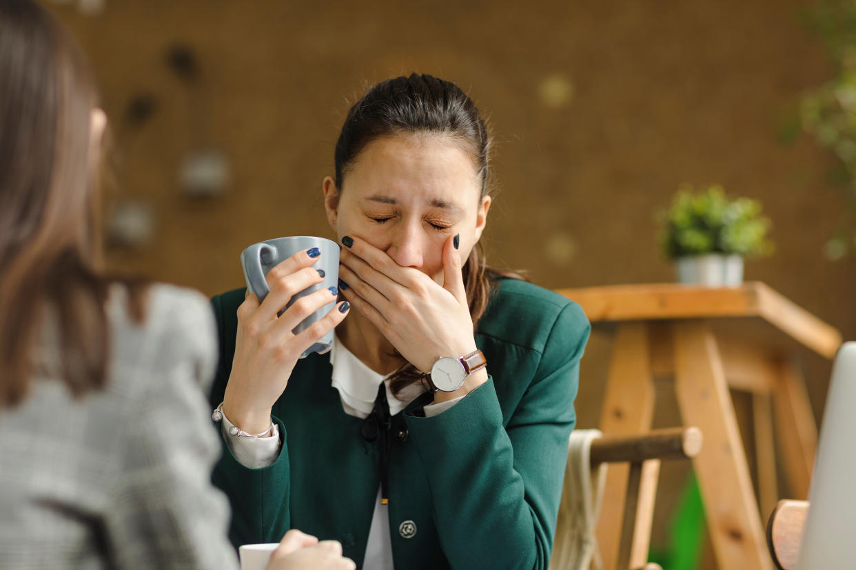 Woman tired at work. (Getty Images)