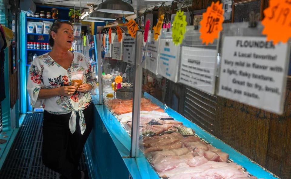 Tonya Hudson, owner of Benny Hudson Seafood Market, reminisces about her father, the namesake of the business, on Friday, March 24, 2023, while talking about a future move that will be five times the size of the existing 900-square-foot seafood market.