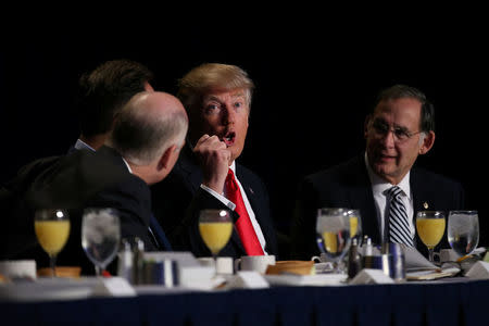 U.S. President Donald Trump gestures as he attends the National Prayer Breakfast in Washington, U.S., February 2, 2017. REUTERS/Carlos Barria