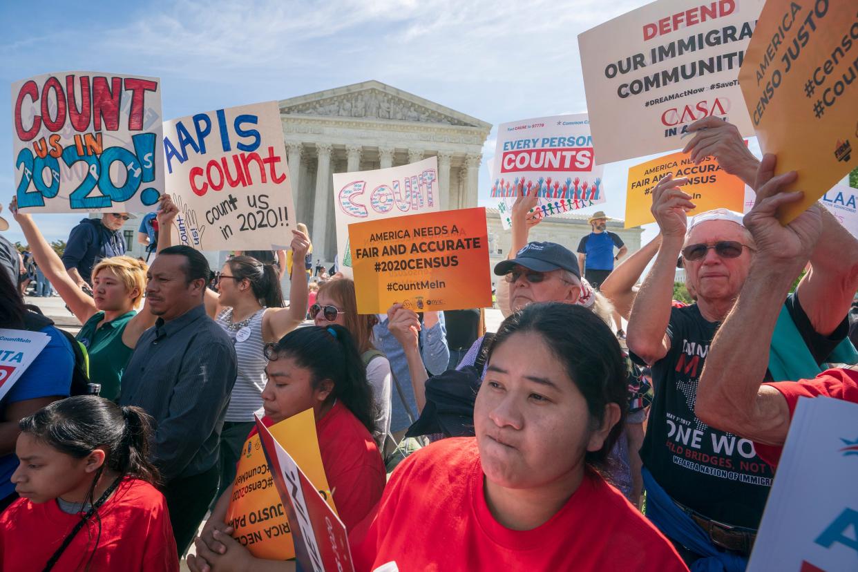 Immigration activists rallied outside the Supreme Court in 2019 as the justices heard arguments about the Trump administration's plan to put a citizenship question on the 2020 census. The court eventually rejected adding the question, but voting rights groups say the issue may have intimidated those in immigrant-heavy communities from responding to the census.