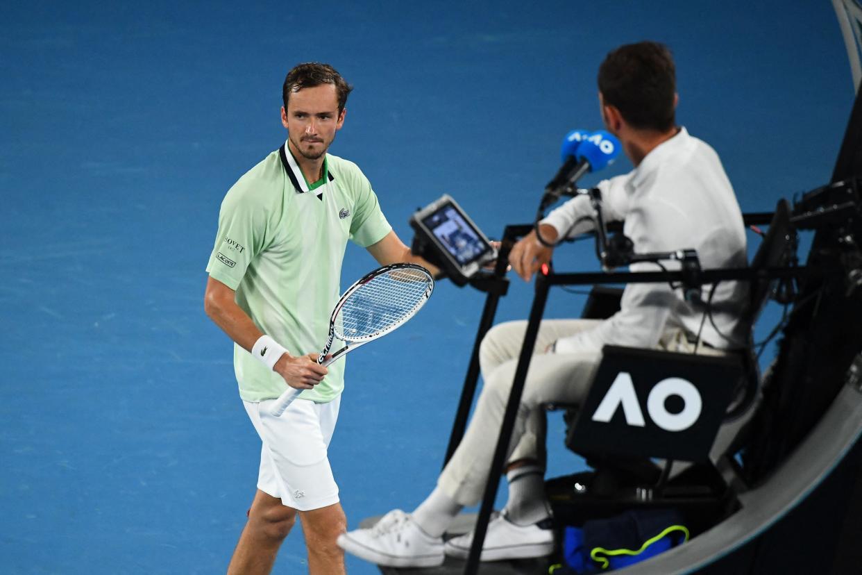 Russia's Daniil Medvedev walks past the umpire during his men's singles semi-final match against Greece's Stefanos Tsitsipas on day twelve of the Australian Open tennis tournament in Melbourne on January 28, 2022. - -- IMAGE RESTRICTED TO EDITORIAL USE - STRICTLY NO COMMERCIAL USE -- (Photo by William WEST / AFP) / -- IMAGE RESTRICTED TO EDITORIAL USE - STRICTLY NO COMMERCIAL USE -- (Photo by WILLIAM WEST/AFP via Getty Images)