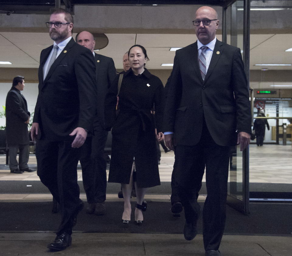 Meng Wanzhou, chief financial officer of Huawei, leaves B.C. Supreme Court in Vancouver, Thursday, January 23, 2020. Wanzhou is in court for hearings over an American request to extradite the executive of the Chinese telecom giant Huawei on fraud charges. (Jonathan Hayward/The Canadian Press via AP)