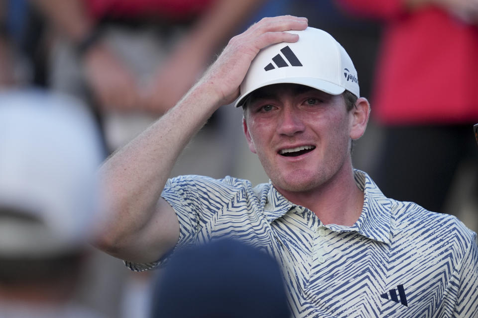 Nick Dunlap reacts after winning the American Express golf tournament, Sunday, Jan. 21, 2024, in La Quinta, Calif. (AP Photo/Ryan Sun)