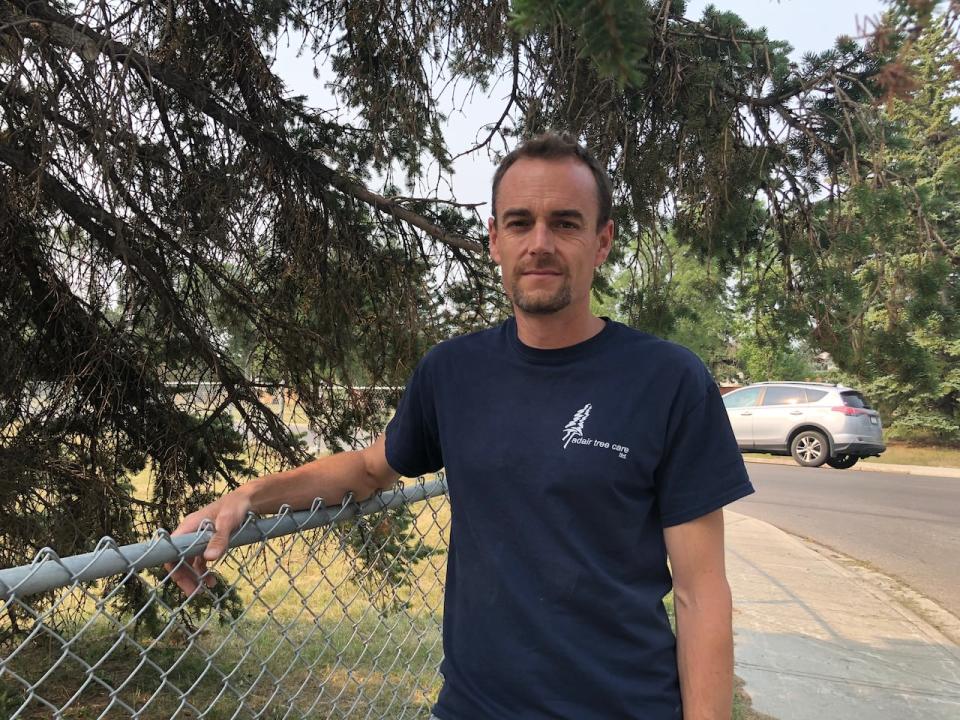 Arborist Matt Davis is urging Calgary residents to moisten the soil beneath their trees to prevent drought-related stress. 