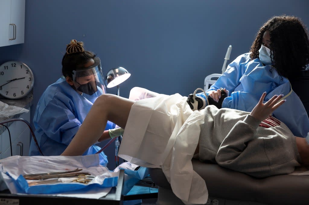Dr Shelly Tien performs an abortion while a nurse assists with ultrasound during the procedure at Planned Parenthood in Birmingham, Alabama (Reuters)