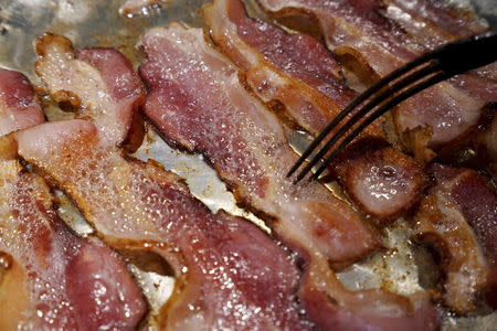 File photo illustration of bacon being fried in a pan, October 26, 2015. REUTERS/Rick Wilking/Files