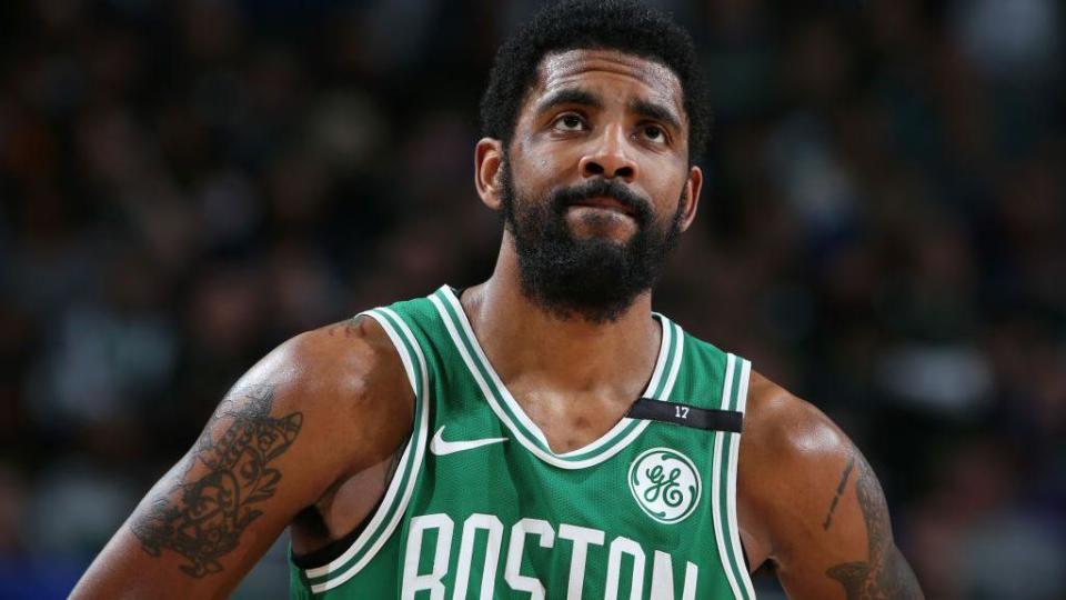 Kyrie Irving appears unhappy in a Boston jersey