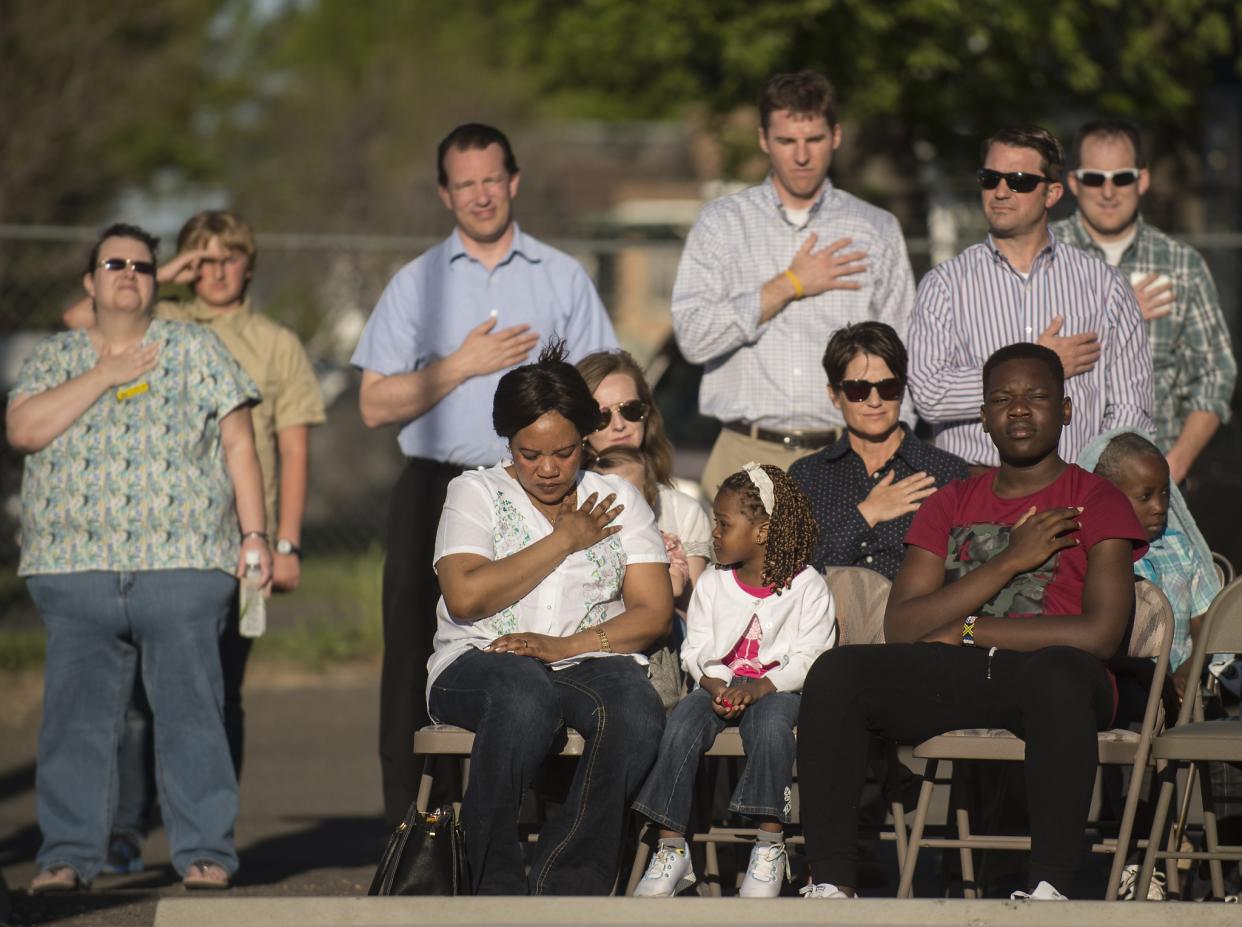 Attendees of the Eagle Scout Porter Buckle flag presentation near the CSI Refugee Center in Twin Falls, Idaho