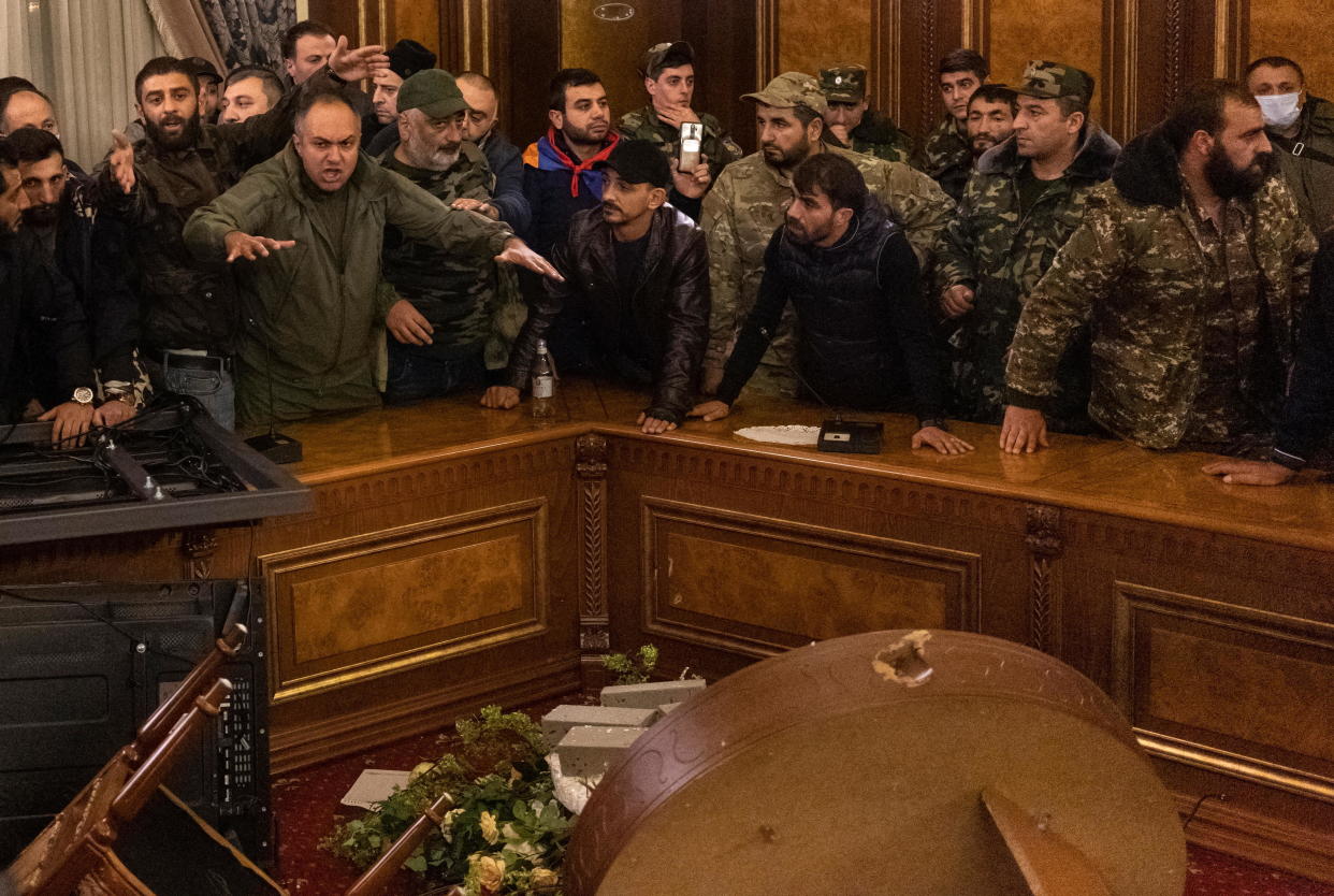 Protesters react inside the parliament after Armenian Prime Minister Nikol Pashinyan said he had signed an agreement with leaders of Russia and Azerbaijan to end the war with Azerbaijan, in Yerevan, Armenia, November 10, 2020. / Credit: REUTERS/Artem Mikryukov