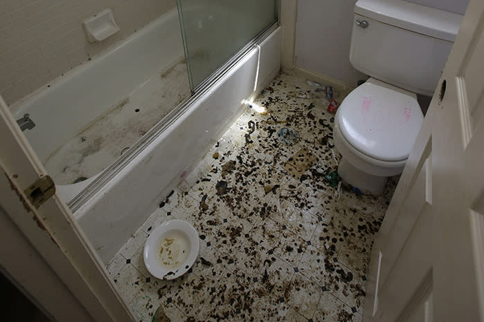 The bathroom floor was found strewn with faeces. Source: AP