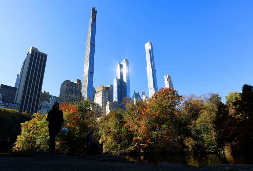 The Steinway Tower and Central Park Tower on Billionaires' Row rise above fall foliage in Central Park on November 9, 2021, in New York City.