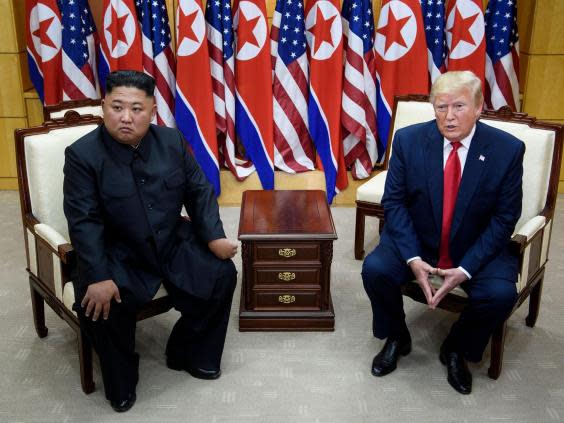 Kim Jong Un and Donald Trump during a meeting in Korea’s demilitarised zone in June 2019 (Getty)