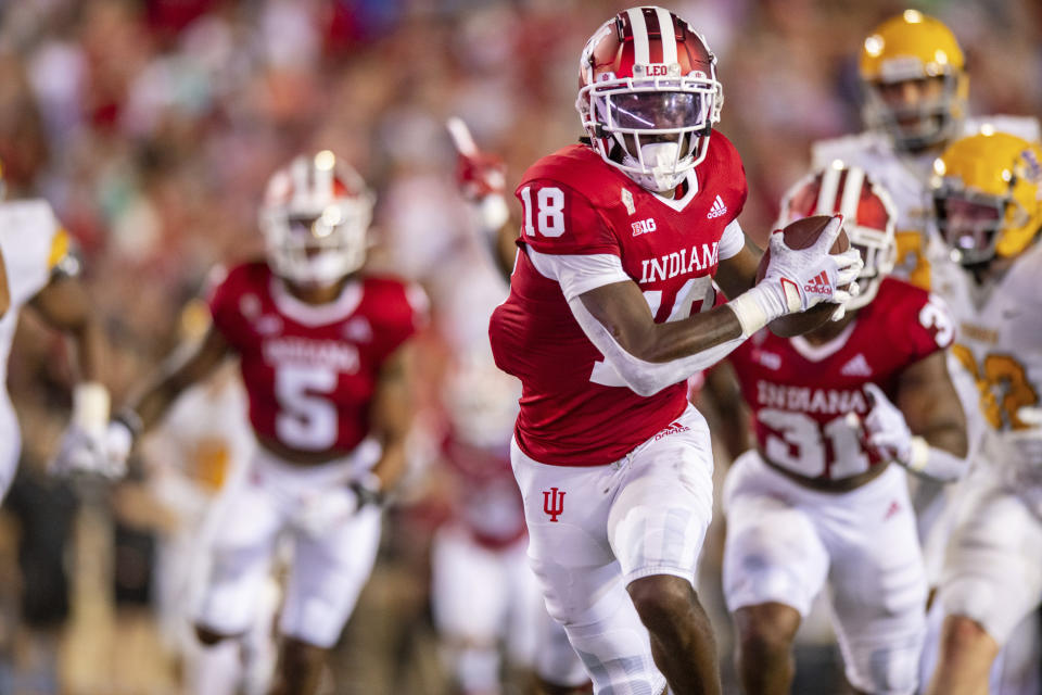 Indiana defensive lineman Jonathan King (18) runs the ball into the end zone to score after recovering a blocked Idaho punt during the first half of an NCAA college football game, Saturday, Sept. 11, 2021, in Bloomington, Ind. (AP Photo/Doug McSchooler)