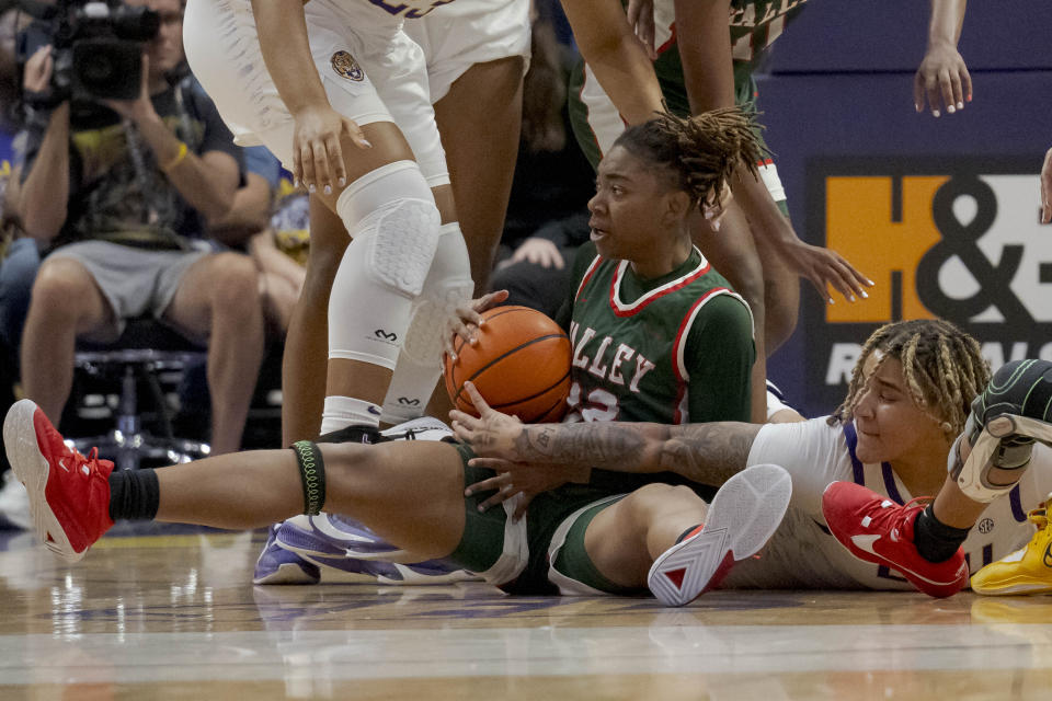 LSU guard Kateri Poole right battles Mississippi Valley State forward Aaliyah Duranham during the first half of an NCAA basketball game on Sunday, Nov. 12, 2023 in Baton Rouge, La. (AP Photo/Matthew Hinton)