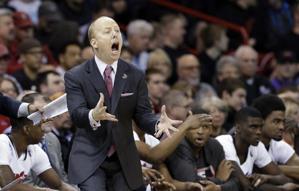 Cincinnati head coach Mick Cronin reacts to a call in favor of Harvard during the second half in the second round of the NCAA college basketball tournament in Spokane, Wash., Thursday, March 20, 2014. Harvard won 61-57. (AP Photo/Elaine Thompson)