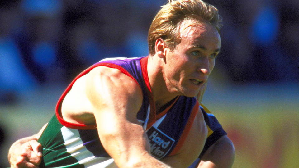 Quenton Leach, pictured here playing for Fremantle against West Coast in 1997.