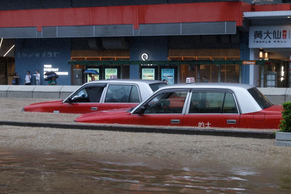 A view of cars partially submerged in flood water following heavy rains.