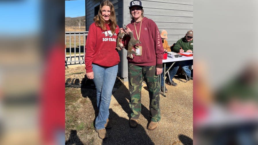 Two teens celebrate at Fred Berry Nature Center in Yellville after a morning of squirrel hunting. (Courtesy Arkansas Game & Fish Commission.)