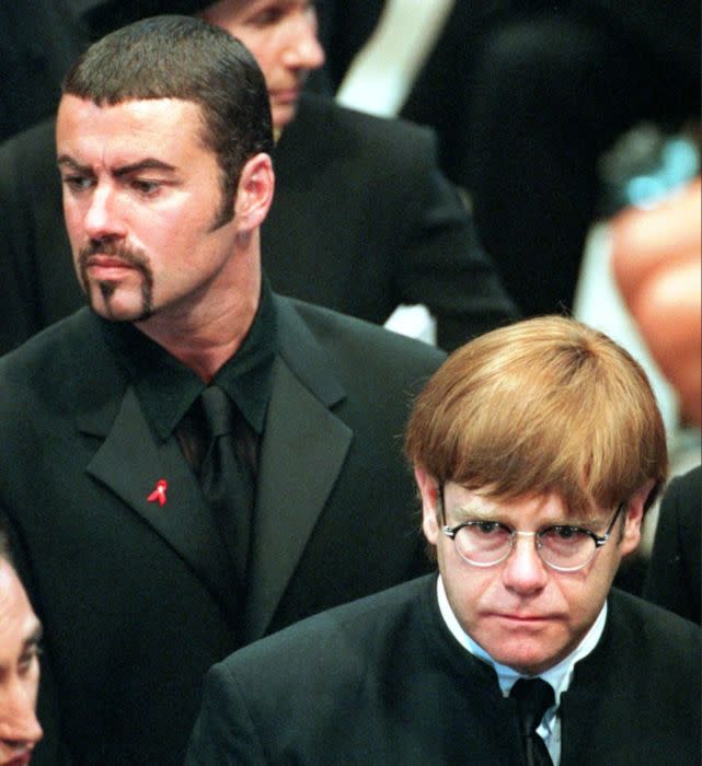 George Michael and Elton John, right, leave Westminster Abbey following the funeral service for Diana