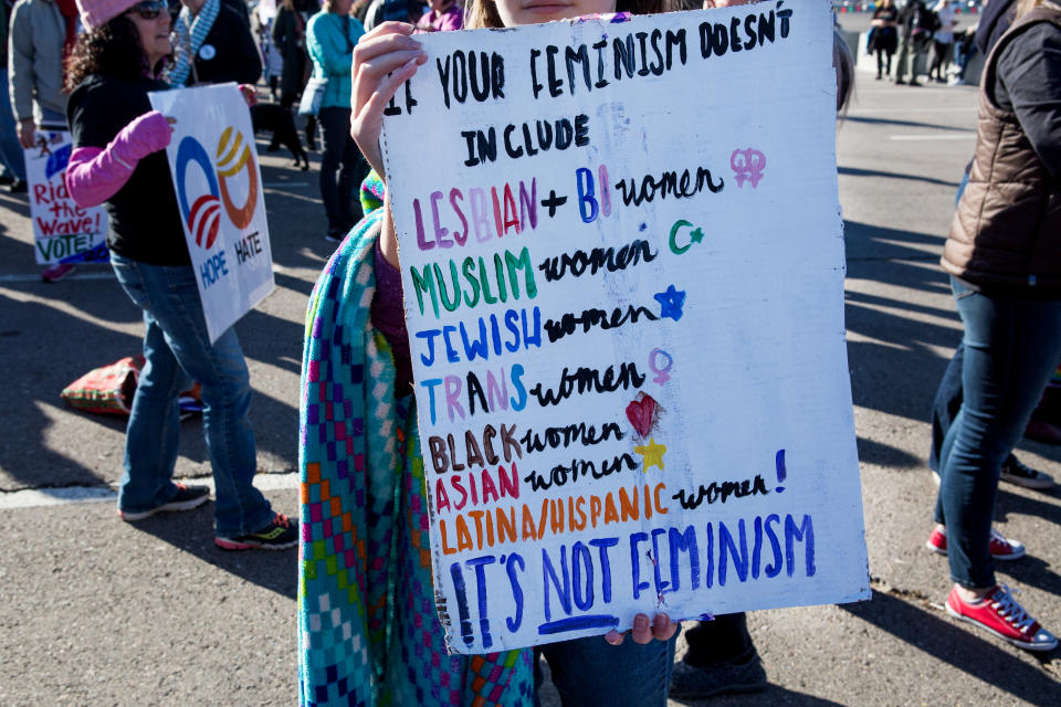 An attendee holds a sign before entering the Sam Boyd Stadium during the Women’s March Anniversary: Power to the Polls event in Las Vegas on Jan. 21. (Photo: Michelle Gustafson/Bloomberg)