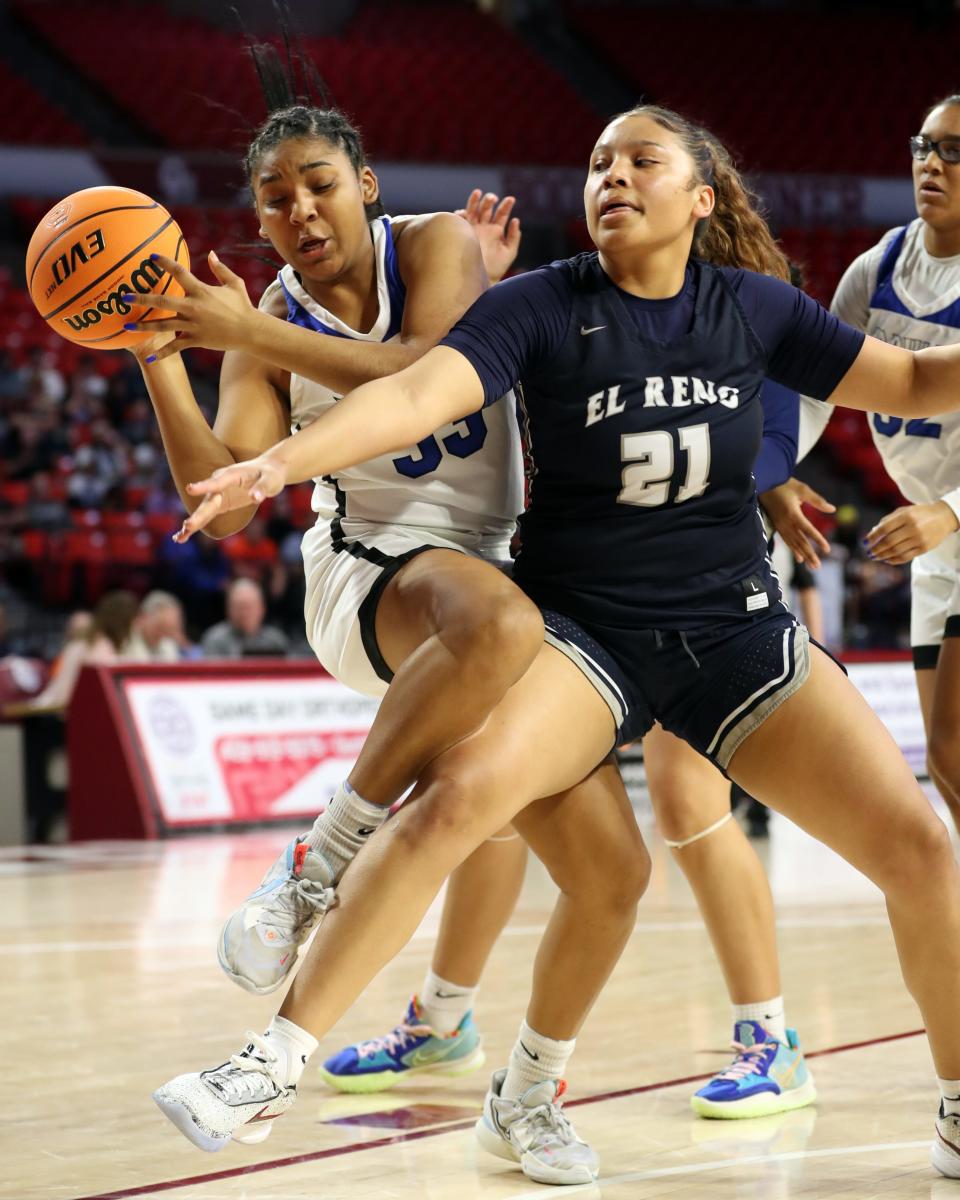 Sapulpa's Tyla Heard tries to get around El Reno's Pauline Black-Harmon as the Sapulpa Lady Chieftains play the El Reno Lady Indians during the Class 5A girls state basketball tournament semifinals at Lloyd Noble Center on March 10, 2023 in Norman.