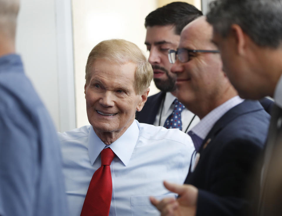 Incumbent Democratic Sen. Bill Nelson, center, stands next to Fred Guttenberg, second from right, who's 14-year-old daughter Jaime was killed in the Marjory Stoneman Douglas High School shooting, wait to speak to members of the media after a debate between Nelson and Republican challenger Rick Scott, who is Florida's governor, in their campaign for a highly competitive U.S. Senate seat, Tuesday, Oct. 2, 2018, in Miramar, Fla. (AP Photo/Wilfredo Lee)