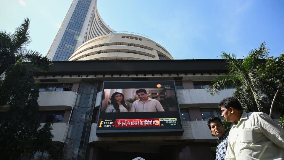 Pedestrians walk past the Bombay Stock Exchange (BSE) building in Mumbai. - Indranil Mukherjee/AFP/Getty Images