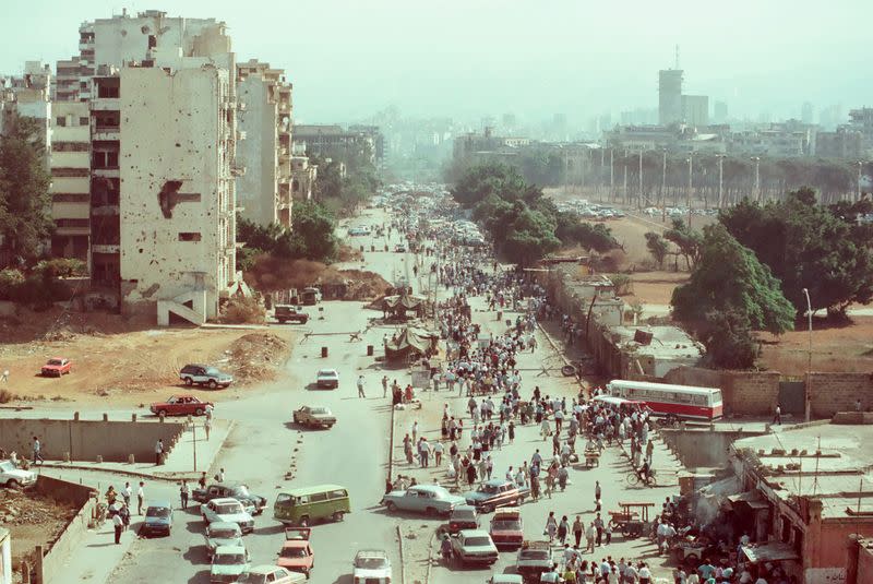 People cross a checkpoint on the "Green Line", in Beirut