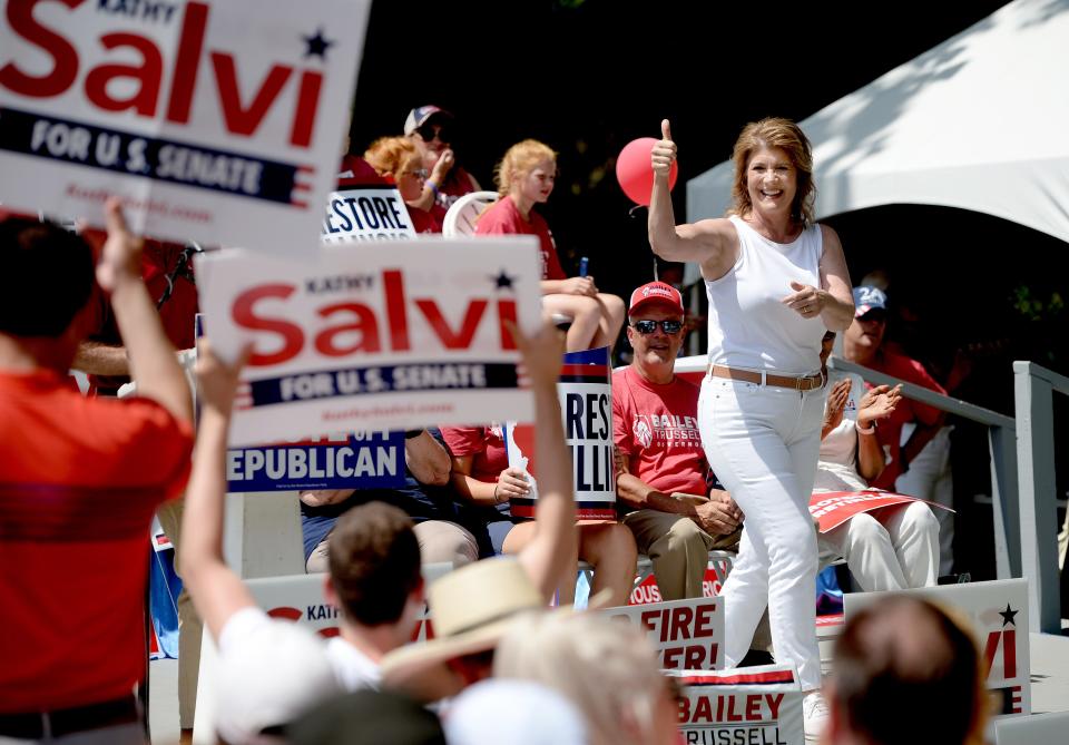 U.S. Senate candidate Kathy Salvi gestures toward supporters as she leaves the stage after speaking at the Republican Day rally at the Illinois State Fair on Thursday.