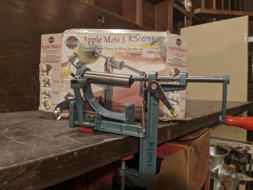 This photo provided by Amanda Blum shows an apple peeler/corer available at The Kitchen Share Library in Portland, Ore. Residents only need photo identification and proof of address to become borrowers. The apple peeler/corer gets checked out often during Oregon's fall harvest. (Amanda Blum via AP)