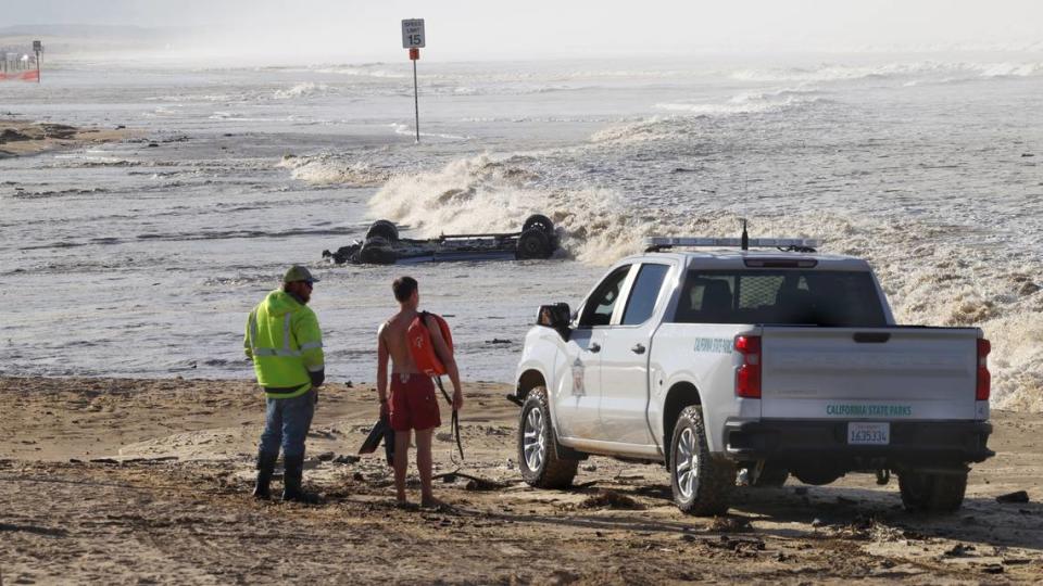 A truck that tried to cross Arroyo Grande Creek was flooded and flipped at Oceano Dunes State Vehicular Recreation Area on Thursday, Dec. 28, 2023. Five occupants were rescued and taken to a local hospital.