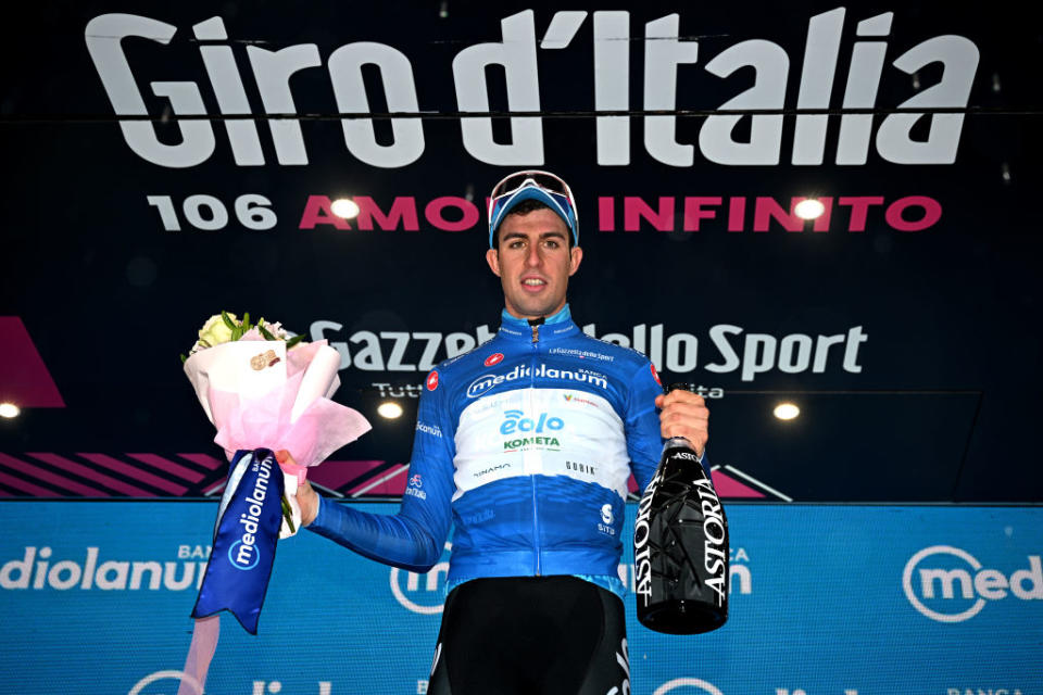 CASSANO MAGNAGO ITALY  MAY 20 Davide Bais of Italy and Team EOLOKometa celebrates at podium as Blue Mountain Jersey winner during the 106th Giro dItalia 2023 Stage 14 a 194km stage from Sierre to Cassano Magnago  UCIWT  on May 20 2023 in Cassano Magnago Italy Photo by Stuart FranklinGetty Images