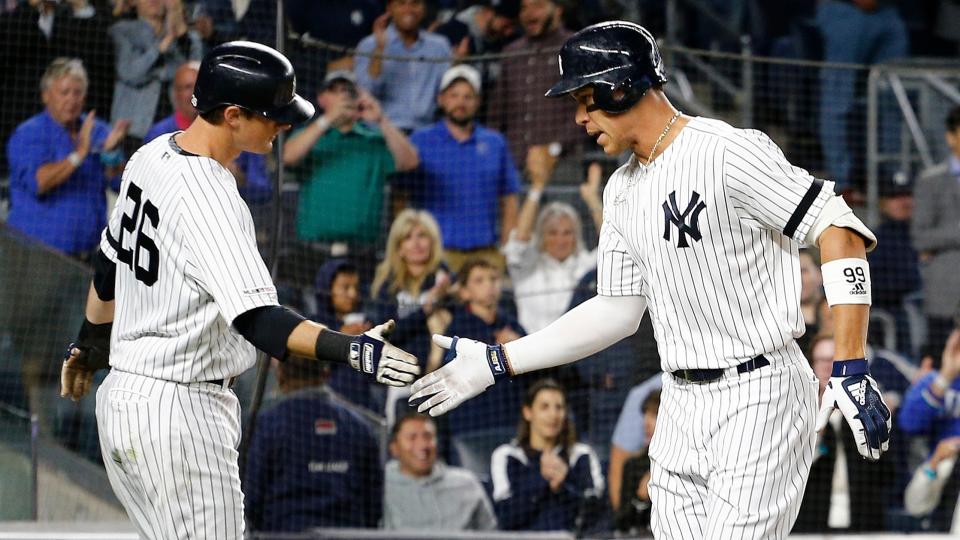 Sep 18, 2019; Bronx, NY, USA; New York Yankees right fielder Aaron Judge (99) is congratulated by second baseman DJ LeMahieu (26) after hitting a two run home run against the Los Angeles Angels during the third inning at Yankee Stadium. Mandatory Credit: Andy Marlin-USA TODAY Sports