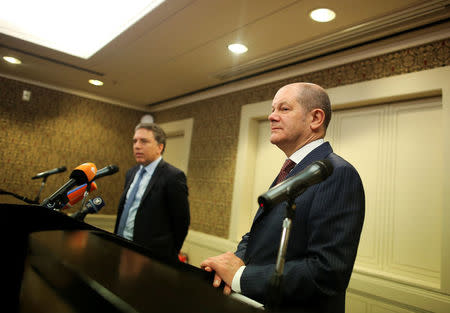 Germany's Finance Minister Olaf Scholz attends a news conference next to Argentina's Treasury Minister Nicolas Dujovne during the 2018 G20 Conference entitled "The G20 Agenda Under the Argentine Presidency", in Buenos Aires, Argentina, March 18, 2018. REUTERS/Agustin Marcarian