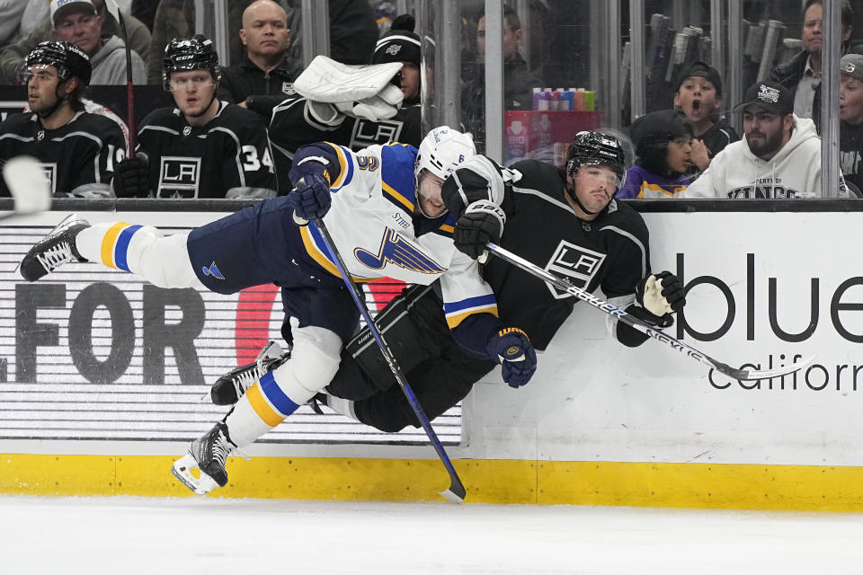 St. Louis Blues defenseman Marco Scandella, left, and Los Angeles Kings left wing Kevin Fiala collide during the second period of an NHL hockey game Saturday, March 4, 2023, in Los Angeles. (AP Photo/Mark J. Terrill)