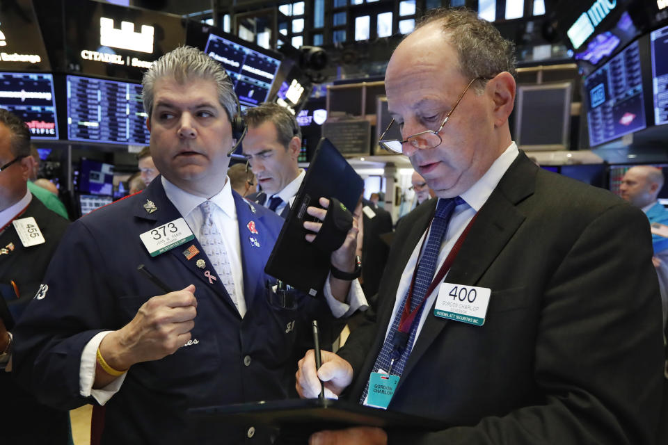 Traders John Panin, left, and Gordon Charlop, right, work on the floor of the New York Stock Exchange, Tuesday, May 28, 2019. Stocks are rising at the open on Wall Street Tuesday, led by technology and consumer-focused companies. (AP Photo/Richard Drew)