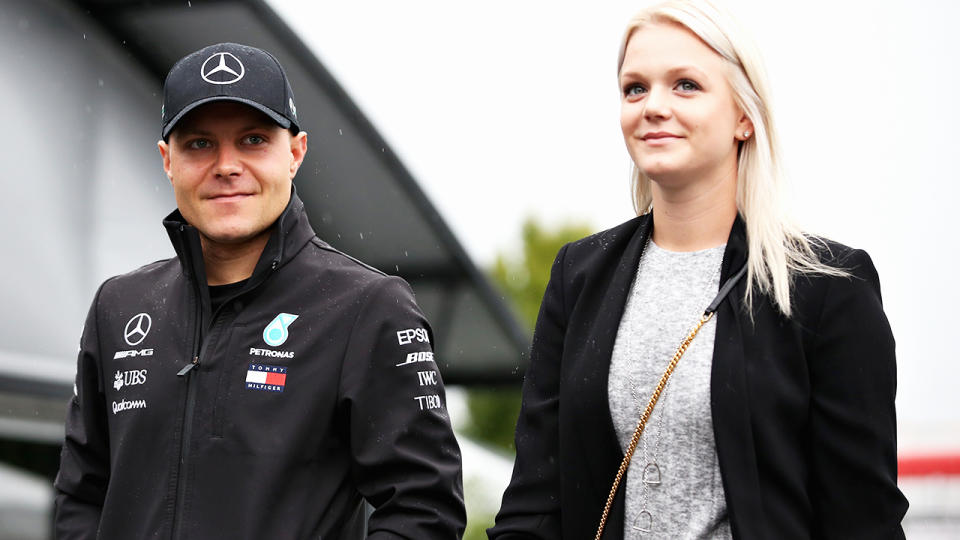 Valtteri Bottas and ex-wife Emilia, pictured here during a Formula One race in 2018. 