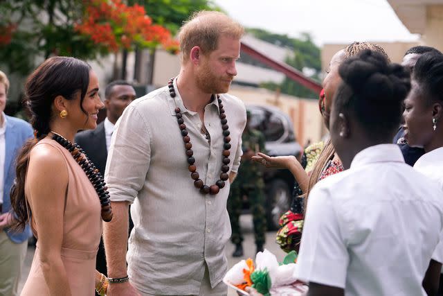 <p>Photo/Sunday Alamba</p> Meghan Markle (Left) and Prince Harry