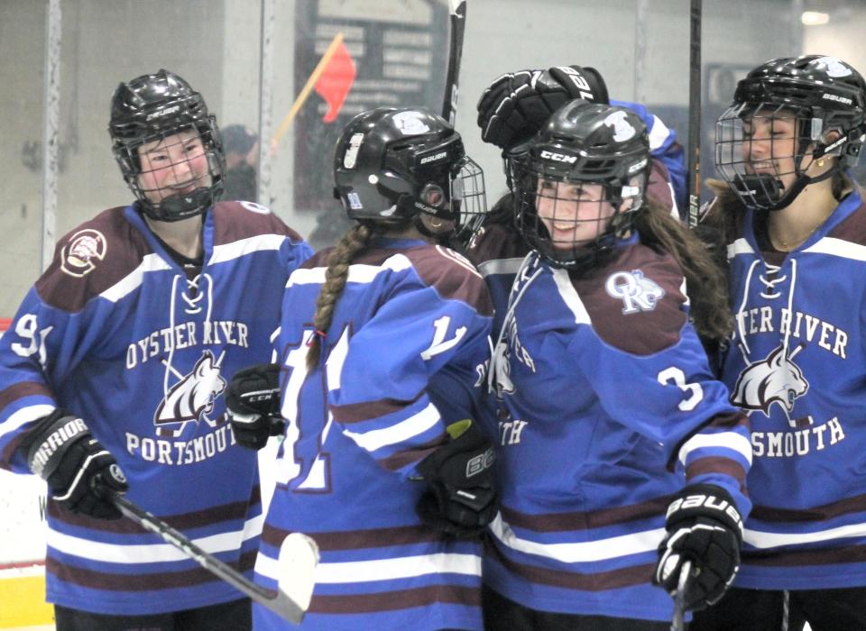 From the left, Eliza Farwell, Meagan Rinko, Sienna Metcalf and Emma Sahr celebrate one of Oyster River-Portsmouth's five goals during Tuesday night's semifinal win over Pinkerton Academy in Concord.
