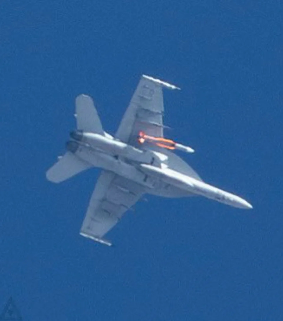 Three more views of the Super Hornet with an SM-6 missile under its starboard wing. <em>Stinkjet</em>