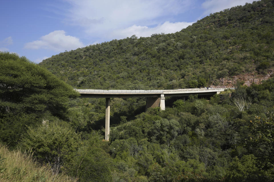 A view of a bridge a day after a bus plunged into a ravine on the Mmamatlakala mountain pass between Mokopane and Marken, around 300km (190 miles) north of Johannesburg, South Africa, Friday, March 29, 2024. A bus carrying worshippers on a long-distance trip from Botswana to an Easter weekend church gathering in South Africa plunged off a bridge on a mountain pass Thursday and burst into flames as it hit the rocky ground below, killing at least 45 people, authorities said. The only survivor was an 8-year-old child who was receiving medical attention for serious injuries. (AP Photo/Themba Hadebe)