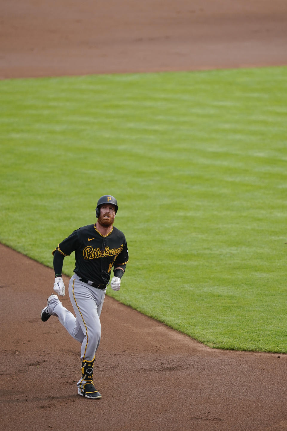 Pittsburgh Pirates' Colin Moran runs the bases after hitting a home run in the first inning of a baseball game against the Cincinnati Reds at Great American Ballpark in Cincinnati, Thursday, Aug. 13, 2020. (AP Photo/Bryan Woolston)