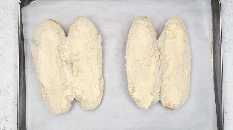 Bread rolls on baking sheet