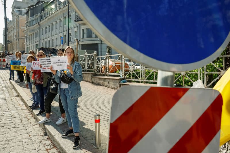 FILE PHOTO: Relatives of Ukrainian servicemen attend a rally to demand lawmakers to determine terms of demobilization, in Kyiv