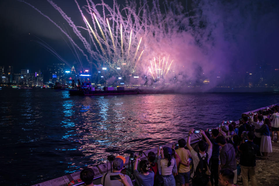 People are watching a fireworks display over Victoria Harbour in Hong Kong on May 1, 2024. This is part of a regular fireworks show by the government in an effort to boost the city's tourism. (Photo by Vernon Yuen/NurPhoto via Getty Images)