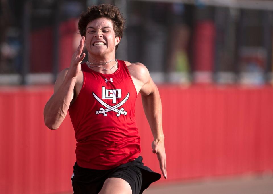 Lubbock-Cooper’s Cal Ritz competes in the 200 meter dash during the District 4-5A track and field meet, Thursday, April 13, 2023, at Pirate Stadium in Woodrow. 