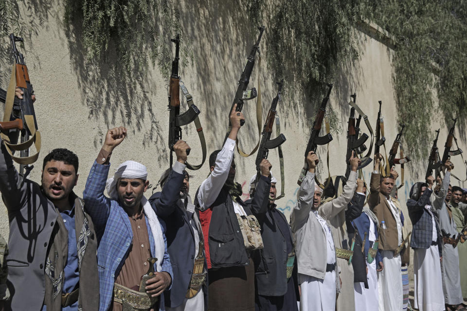 Tribesmen loyal to the Houthi rebels chant slogans as they hold their weapons during a gathering aimed at mobilizing more fighters for the Houthi movement in Sanaa, Yemen, Tuesday, Feb. 25, 2020. (AP Photo/Hani Mohammed)