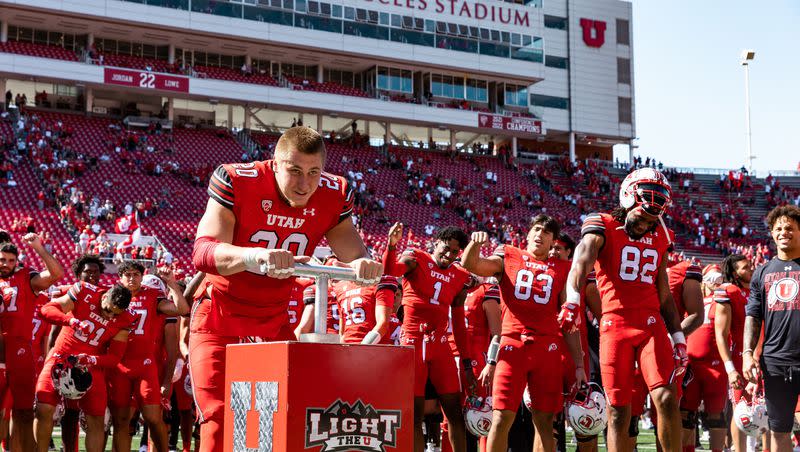 Utah Utes linebacker Lander Barton (20) lights the U after their victory over the Weber State Wildcats at Rice-Eccles Stadium in Salt Lake City on Saturday, Sept. 16, 2023.